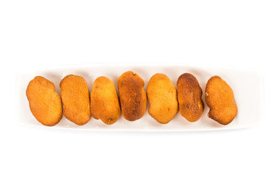 Close-up of cake against white background