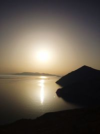 Scenic view of sea against clear sky during sunset