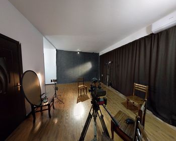 Empty chairs and tables on hardwood floor