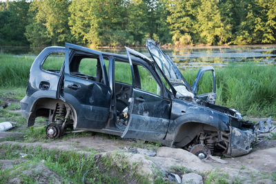 Abandoned car on field