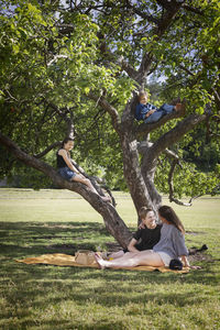 Mother with children having picnic together