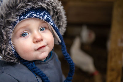 Portrait of cute baby boy in winter