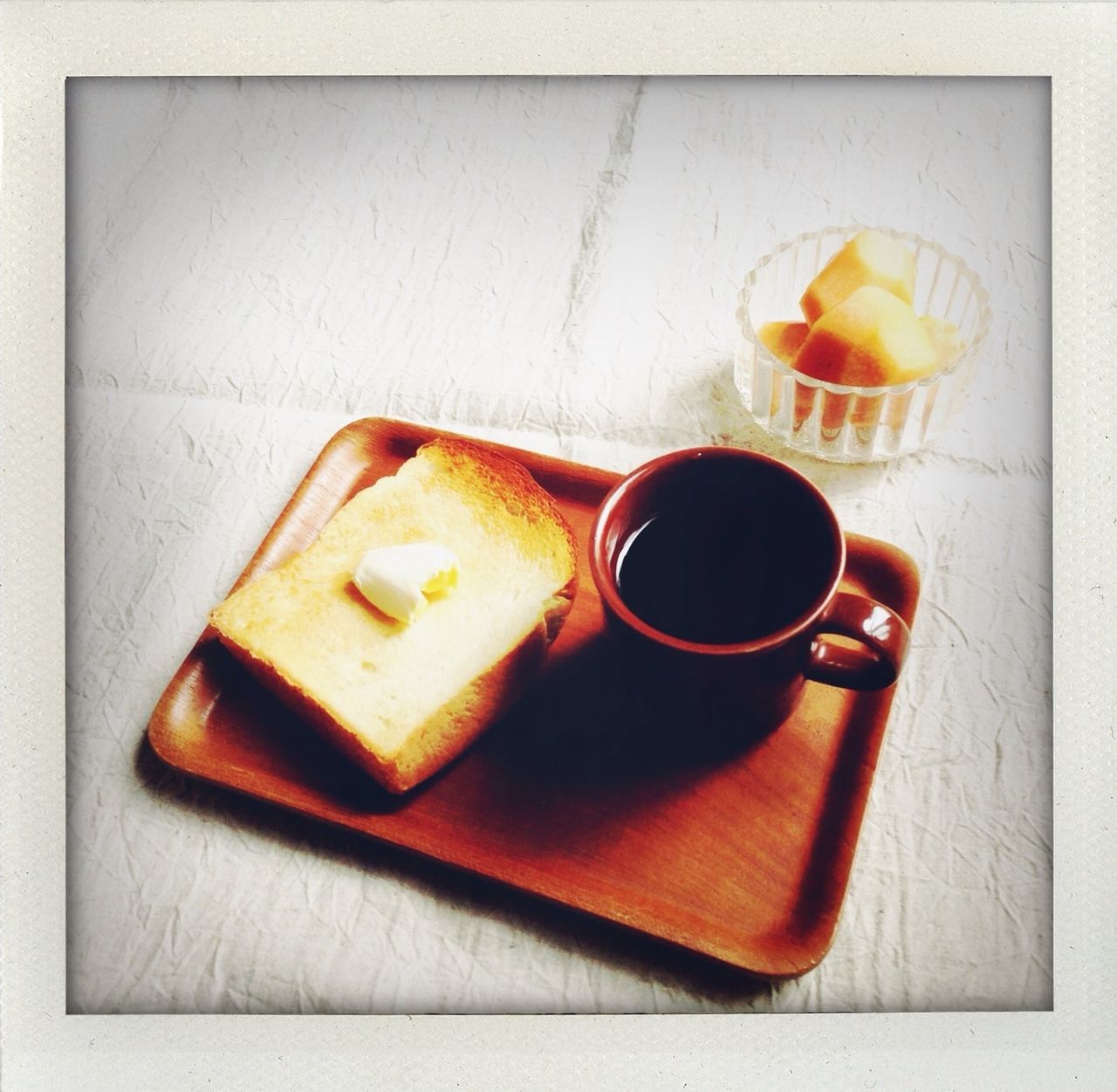 food and drink, indoors, freshness, table, food, still life, coffee cup, drink, refreshment, breakfast, coffee - drink, ready-to-eat, close-up, healthy eating, high angle view, sweet food, plate, bread, coffee, indulgence