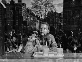 Portrait of people sitting in restaurant