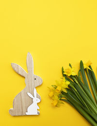 Close-up of christmas decorations on yellow background