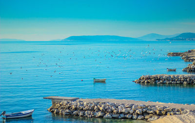 Scenic view of sea against blue sky