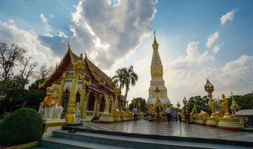 Panoramic view of temple against building and sky