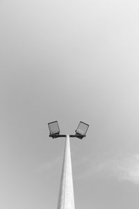 Low angle view of windmill against sky