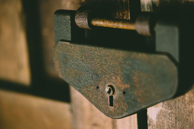 Close-up of padlock on metal door