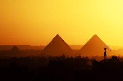 Silhouette of mountain against clear sky at sunset