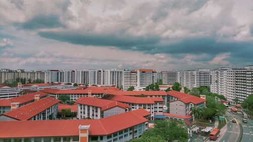 High angle view of buildings in city against sky