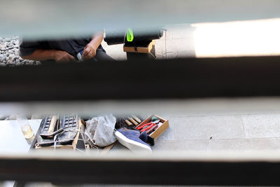 Low section of person with book on table