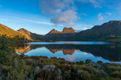 Scenic view of lake and mountains against sky