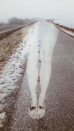 Road amidst snow covered land