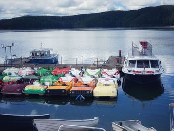 High angle view of boats moored in lake against sky