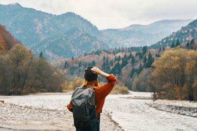 Rear view of man looking at mountains