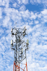 Low angle view of communications tower against sky