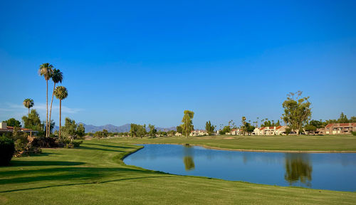 Scenic view of lake inside a golf course an