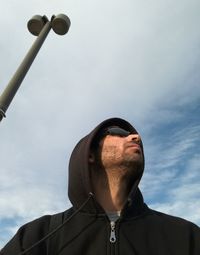 Low angle view of man against sky