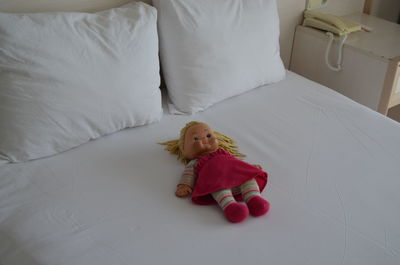 High angle view of doll on bed