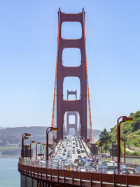 View of bridge against clear blue sky