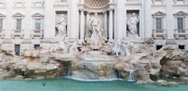 Fountain in front of historical building