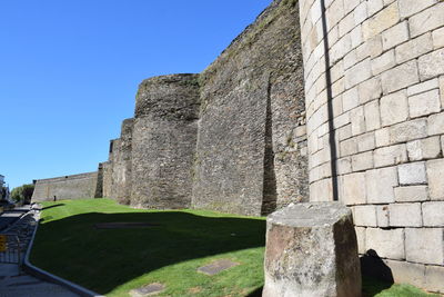 Low angle view of fort against clear sky