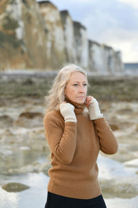 Portrait of a sixty-year-old woman with a gray hair