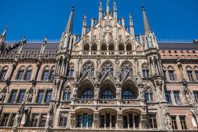 Low angle view of historical building against blue sky