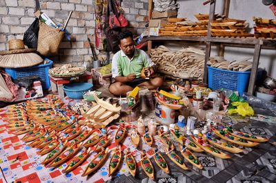 People working at market stall