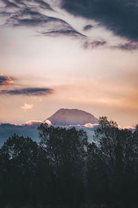 Scenic view of silhouette mountains against sky at sunset