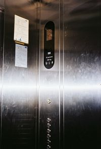Close-up of text on glass door