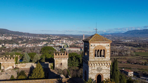 High angle view of historic building against clear blue sky