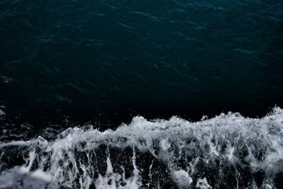 High angle view of water flowing over sea