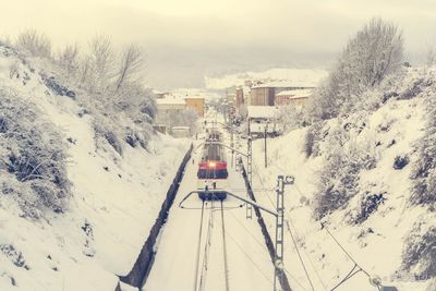 High angle view of train on snow covered railroad tracks