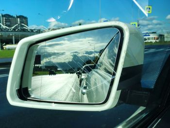 Reflection of car on side-view mirror