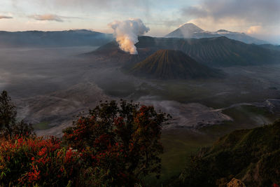 Scenic view of volcanic mountain range against sky