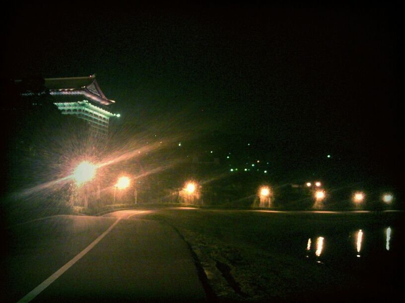 illuminated, night, dark, lighting equipment, light - natural phenomenon, transportation, glowing, copy space, built structure, street light, architecture, no people, the way forward, empty, street, building exterior, in a row, light, road, outdoors