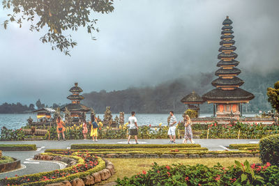 Panoramic view of temple against buildings