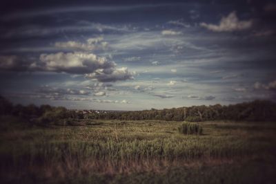 Scenic view of landscape against cloudy sky