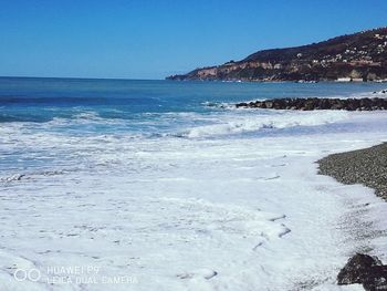 Scenic view of sea against clear sky