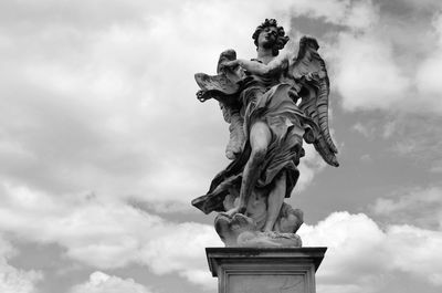 Low angle view of statue against sky