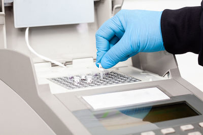 Scientist working at the laboratory with a thermal cycler. polymerase chain reaction technique. 