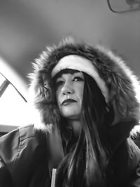 Close-up portrait of a young woman looking away