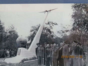 Statue against trees and plants