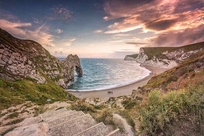 Scenic view of durdle door during sunset