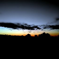 Scenic view of dramatic sky during sunset