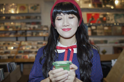 Portrait of a beautiful young woman using her cell phone