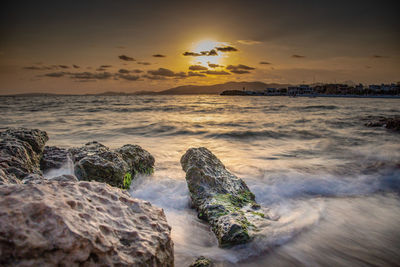 Scenic view of sea against sky during sunset