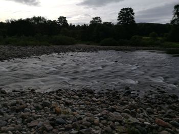 View of river against cloudy sky